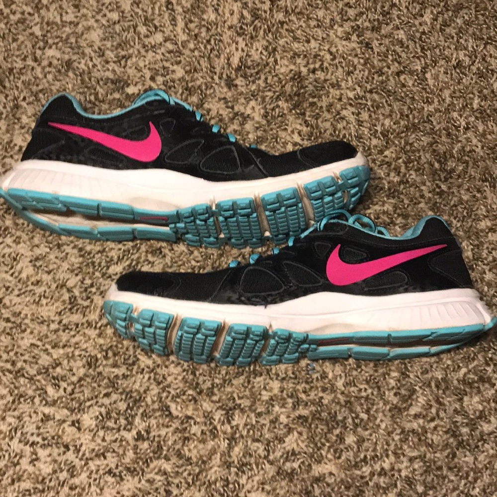 Black and blue nike athletic shoes